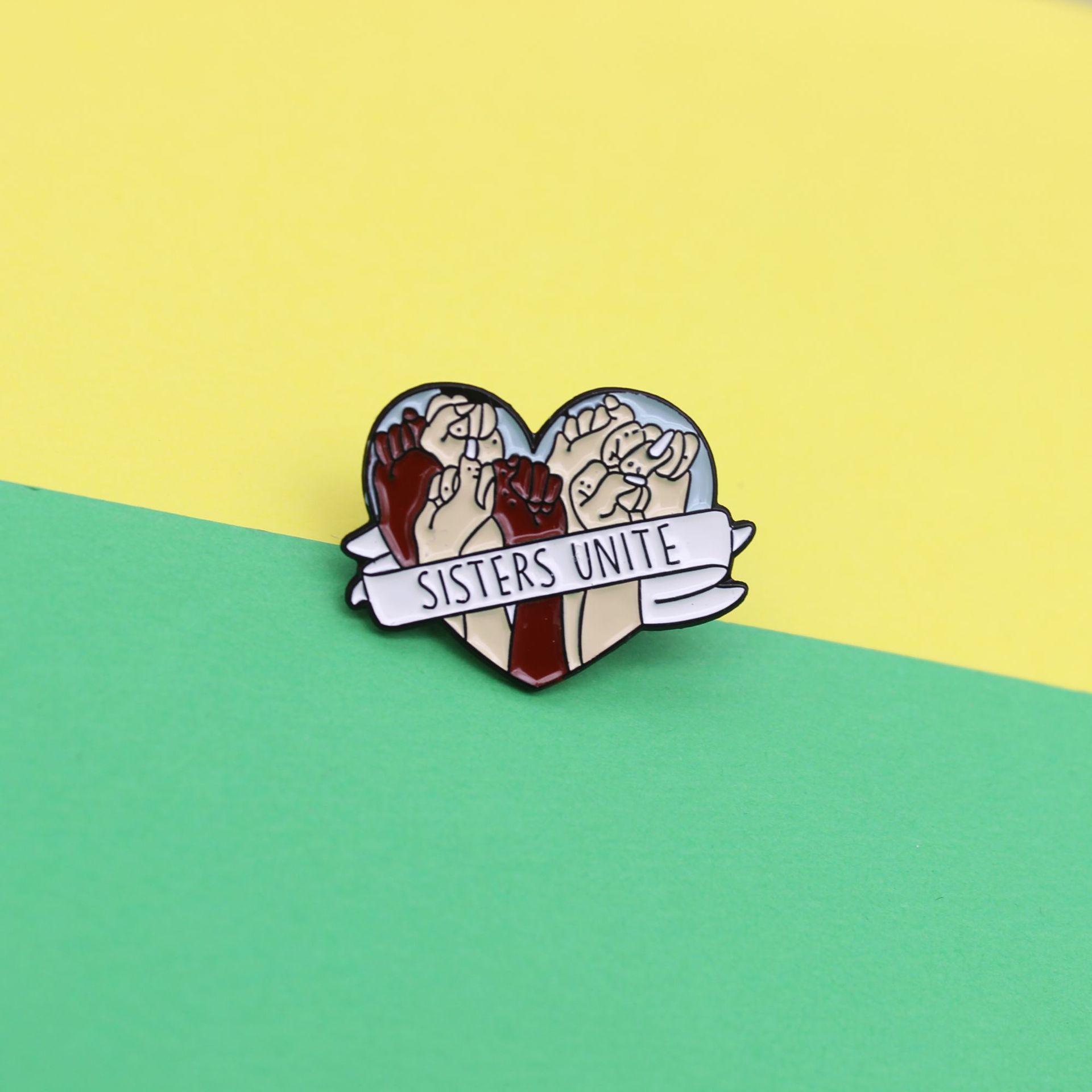 Heart-Shaped Ribbon Wrapped Around a Fist Brooch